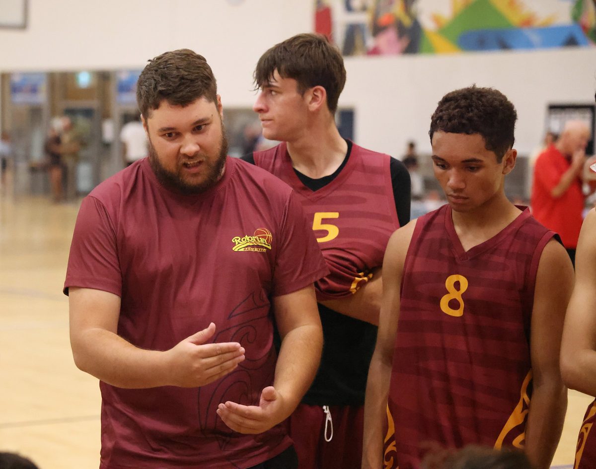 Rotorua coach explains a play to nearby players.