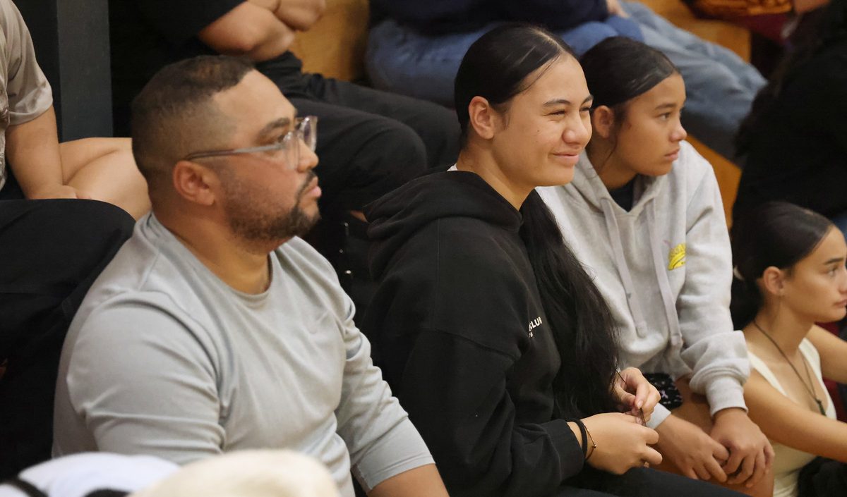 Spectators watch the tournament from courtside seating.