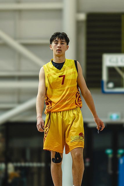 Rotorua number 7 watches the play in a gold uniform.