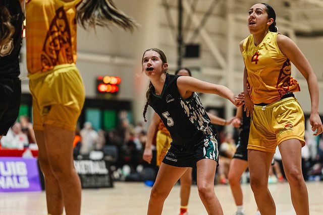 Rotorua number 4 and an opponent look upward during a play.