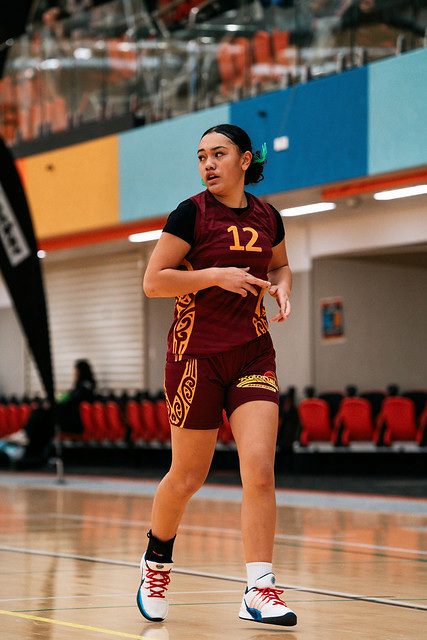 Rotorua number 12 looks across the court, ready for the next play.