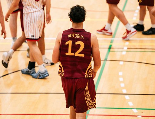 Rotorua number 12 faces the court with the team name visible on his jersey.